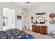 Charming main bedroom featuring a stylish dresser, mirror, and hats adding character to the inviting space at 12873 N 175Th Dr, Surprise, AZ 85388