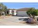 A well-manicured lawn and a two-car garage on a clean, single-story home exterior at 12873 N 175Th Dr, Surprise, AZ 85388