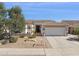 Charming single-story home with a desert landscape, three-car garage, and well-maintained curb appeal at 12873 N 175Th Dr, Surprise, AZ 85388
