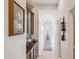 Long hallway with dark cabinets, carpet runner, and accent lighting at 12873 N 175Th Dr, Surprise, AZ 85388