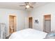 Comfortable bedroom featuring a queen bed, ceiling fan, and ensuite bathroom and walk-in closet at 1350 S Greenfield Rd # 1016, Mesa, AZ 85206