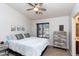 Nicely decorated bedroom featuring a ceiling fan, neutral colored walls, and rustic decor at 1350 S Greenfield Rd # 1016, Mesa, AZ 85206