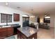 Kitchen with a center island open to the living and dining area at 1350 S Greenfield Rd # 1016, Mesa, AZ 85206