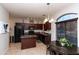 Kitchen featuring stainless steel appliances, an island, and pendant lighting above the breakfast table at 1350 S Greenfield Rd # 1016, Mesa, AZ 85206