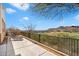 Spacious outdoor patio area with wrought iron lounge chairs overlooking the community's golf course at 14927 E Desert Willow Dr # 6, Fountain Hills, AZ 85268