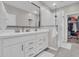 Modern bathroom with double vanity, walk-in shower, and ample storage space at 155 N Lakeview Blvd # 206, Chandler, AZ 85225