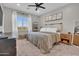 Serene bedroom featuring soft lighting, cozy carpet, and a large window at 155 N Lakeview Blvd # 206, Chandler, AZ 85225