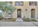 Charming townhome exterior featuring a private entrance, landscaped walkway, and balcony at 155 N Lakeview Blvd # 206, Chandler, AZ 85225