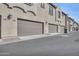 Street view of residential garages in a well-maintained community at 155 N Lakeview Blvd # 206, Chandler, AZ 85225
