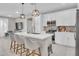 Modern kitchen featuring a center island with pendant lighting and bar stool seating at 155 N Lakeview Blvd # 206, Chandler, AZ 85225