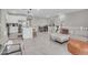 Open-concept living space with stylish furnishings, neutral tones, and tile floors at 155 N Lakeview Blvd # 206, Chandler, AZ 85225