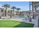 Community pool surrounded by lush landscaping and well-appointed apartment buildings at 155 N Lakeview Blvd # 206, Chandler, AZ 85225