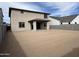 A home's spacious backyard includes a covered patio and has fresh dirt ready for landscaping at 18047 W Vogel Ave, Goodyear, AZ 85338