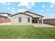 An inviting backyard features well-kept turf, and a brick patio ready for relaxation and entertainment at 18153 W Fulton St, Goodyear, AZ 85338
