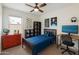 Playful bedroom with colorful decor, a study area, and plenty of storage space at 18153 W Fulton St, Goodyear, AZ 85338