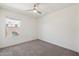 Comfortable bedroom featuring carpeted floors, a window, and neutral paint at 18153 W Fulton St, Goodyear, AZ 85338