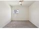 Bedroom with neutral walls, carpet floors, and a bright window at 18153 W Fulton St, Goodyear, AZ 85338