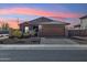 Charming single-story home with well-manicured landscaping and a two-car garage at 18153 W Fulton St, Goodyear, AZ 85338