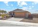 Charming single-story home featuring stone accents and a tile roof at 18153 W Fulton St, Goodyear, AZ 85338