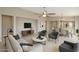Bright, open living room featuring modern decor and a seamless flow to the dining area at 18153 W Fulton St, Goodyear, AZ 85338