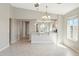 Bright living room with views to the modern kitchen with a breakfast bar at 18153 W Fulton St, Goodyear, AZ 85338