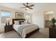 Tranquil main bedroom with ample natural light, ensuite bathroom, and cozy, modern furnishings at 18153 W Fulton St, Goodyear, AZ 85338