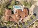 Expansive home showcases a sparkling pool, putting green, and well-manicured landscaping at 19494 N 98Th Pl, Scottsdale, AZ 85255