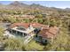 Gorgeous home featuring a large pool, covered patio, desert landscaping, and spectacular mountain views at 19494 N 98Th Pl, Scottsdale, AZ 85255