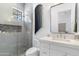 Modern bathroom featuring a glass-enclosed shower with stylish tile, a sleek vanity, and contemporary fixtures at 19494 N 98Th Pl, Scottsdale, AZ 85255