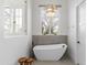 Bright bathroom with a freestanding tub and modern fixtures at 19494 N 98Th Pl, Scottsdale, AZ 85255