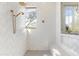 Bright bathroom featuring a spacious shower with white herringbone tile and brass fixtures at 19494 N 98Th Pl, Scottsdale, AZ 85255