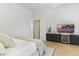 Bedroom featuring built-in bar, beverage fridge, mounted television and a view at 19494 N 98Th Pl, Scottsdale, AZ 85255