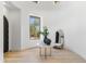 Bright, airy foyer with wood floors, arched window, and stylish decor at 19494 N 98Th Pl, Scottsdale, AZ 85255