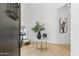 Inviting foyer with marble table, wood floors, and modern accents at 19494 N 98Th Pl, Scottsdale, AZ 85255