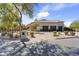 Elegant home with a three-car garage, brick paver driveway, and well-maintained desert landscaping at 19494 N 98Th Pl, Scottsdale, AZ 85255