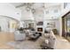Bright living room with fireplace, high ceilings, and elegant decor at 19494 N 98Th Pl, Scottsdale, AZ 85255