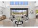 Bright and airy living room offering an open floor plan with views of the outdoors at 19494 N 98Th Pl, Scottsdale, AZ 85255