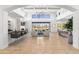 Open living space with high ceilings, a fireplace, and expansive windows at 19494 N 98Th Pl, Scottsdale, AZ 85255