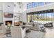 Spacious living room features a fireplace, comfortable seating, and large windows at 19494 N 98Th Pl, Scottsdale, AZ 85255