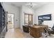 Bright office with wood desk, french doors and stylish decor at 19494 N 98Th Pl, Scottsdale, AZ 85255
