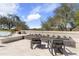 A spacious patio featuring a linear fire pit and comfortable seating at 19494 N 98Th Pl, Scottsdale, AZ 85255