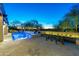 Backyard with a pool, spa, in-pool lounge chairs, and views of the sunset at 19494 N 98Th Pl, Scottsdale, AZ 85255
