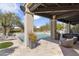 An elegant pool patio with seating areas and desert landscaping surrounding the pool, perfect for enjoying the outdoors at 19494 N 98Th Pl, Scottsdale, AZ 85255