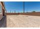 View of a fenced-in backyard area with desert landscaping and ample space at 20624 S 216Th Pl, Queen Creek, AZ 85142