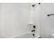 Clean white bathroom features a shower with sleek, modern fixtures and tiling at 20624 S 216Th Pl, Queen Creek, AZ 85142