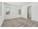 Carpeted bedroom featuring windows and an open doorway to the bathroom at 20624 S 216Th Pl, Queen Creek, AZ 85142