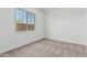 Bright bedroom with neutral carpeting and view of outside at 20624 S 216Th Pl, Queen Creek, AZ 85142