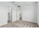Neutral carpeted bedroom with an open door leading into closet space at 20624 S 216Th Pl, Queen Creek, AZ 85142