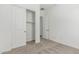 Neutral carpeted bedroom with an open door leading into closet space at 20624 S 216Th Pl, Queen Creek, AZ 85142