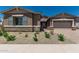 Charming single-story home featuring a two-car garage, desert landscaping, and a welcoming entrance at 20624 S 216Th Pl, Queen Creek, AZ 85142